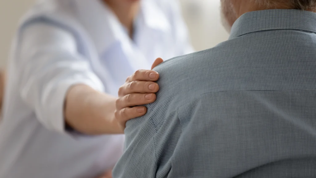 Shoulder surgery consultation a between patient and a doctor on whether the patient's rotator cuff tear needs surgery.