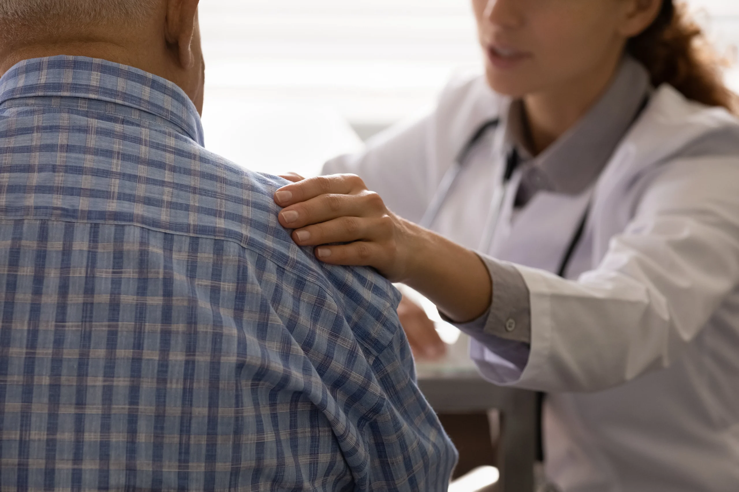 patient consulting with surgeon about their shoulder impingement diagnosis